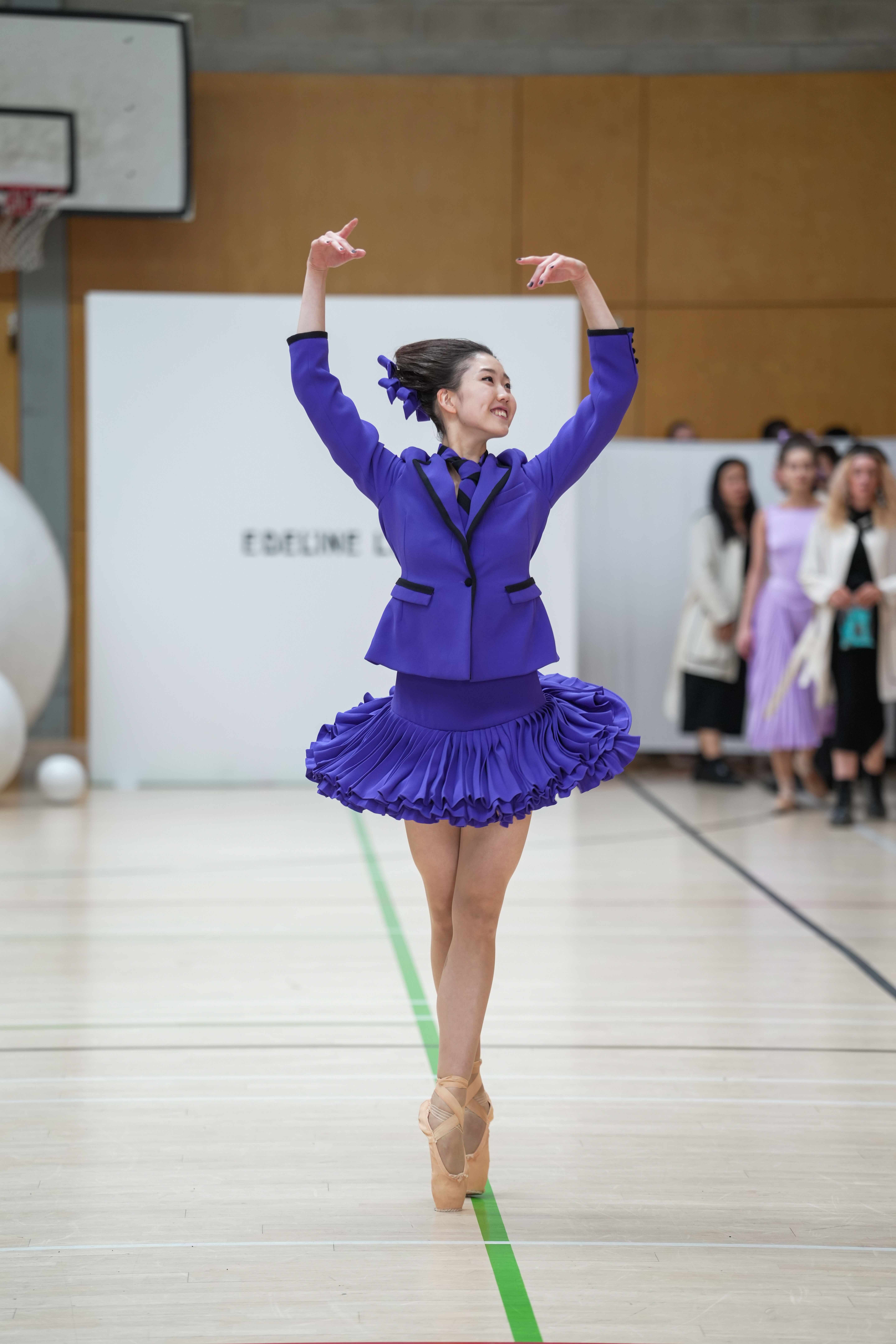 A ballet dancer in one of Lee's vibrant purple designs