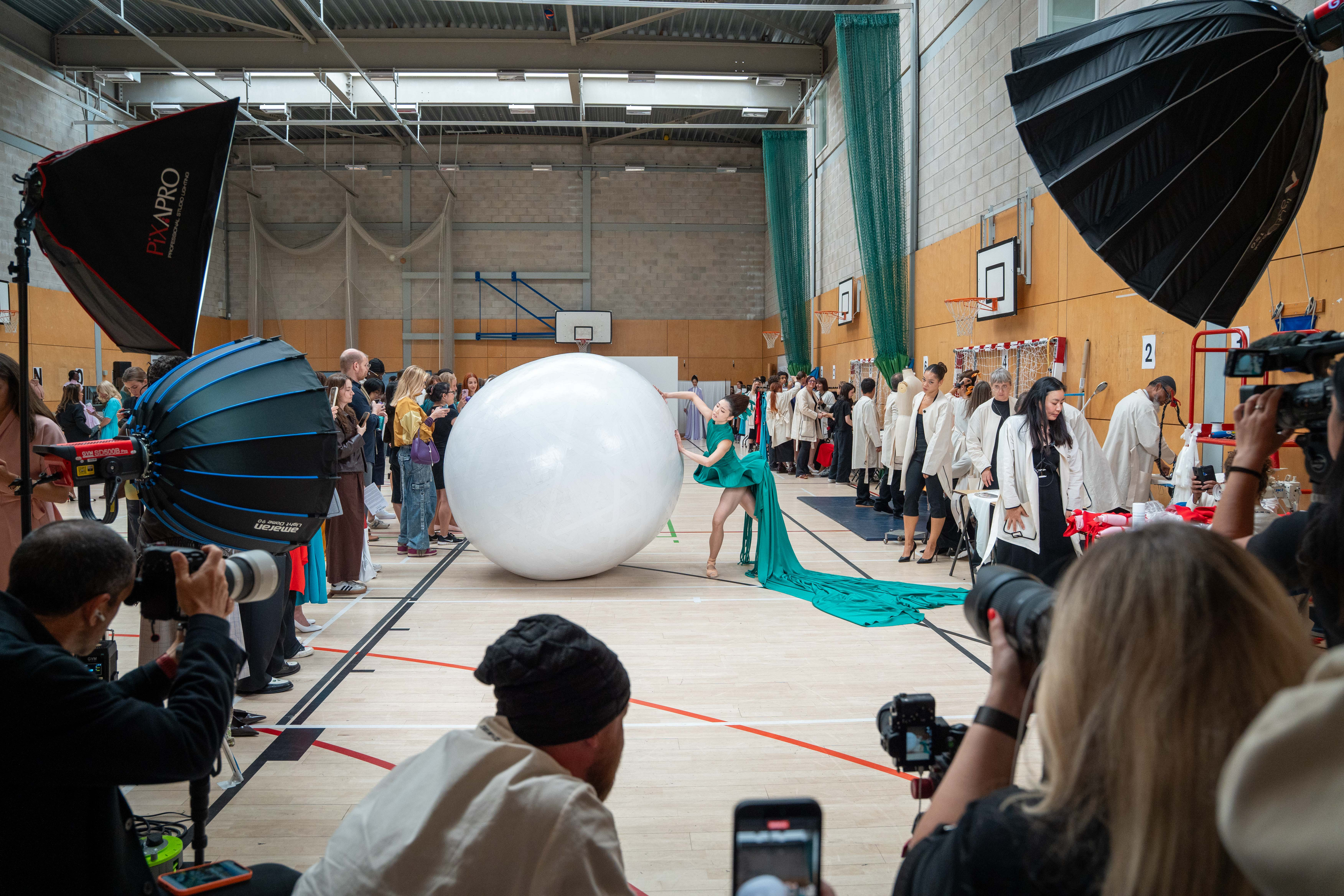 A model pushing a 'boulder'