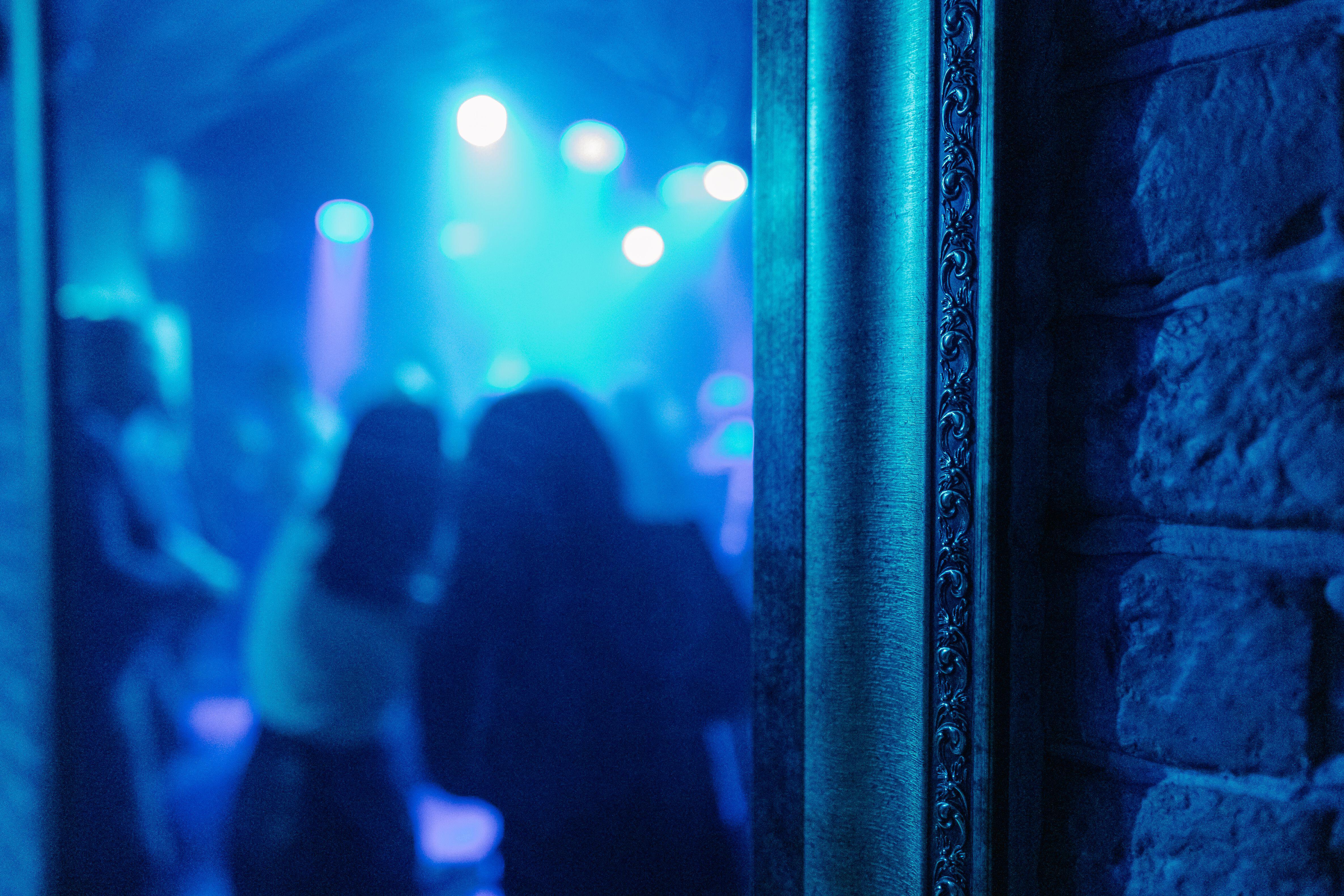 A wall illuminated by spotlights in a nightclub