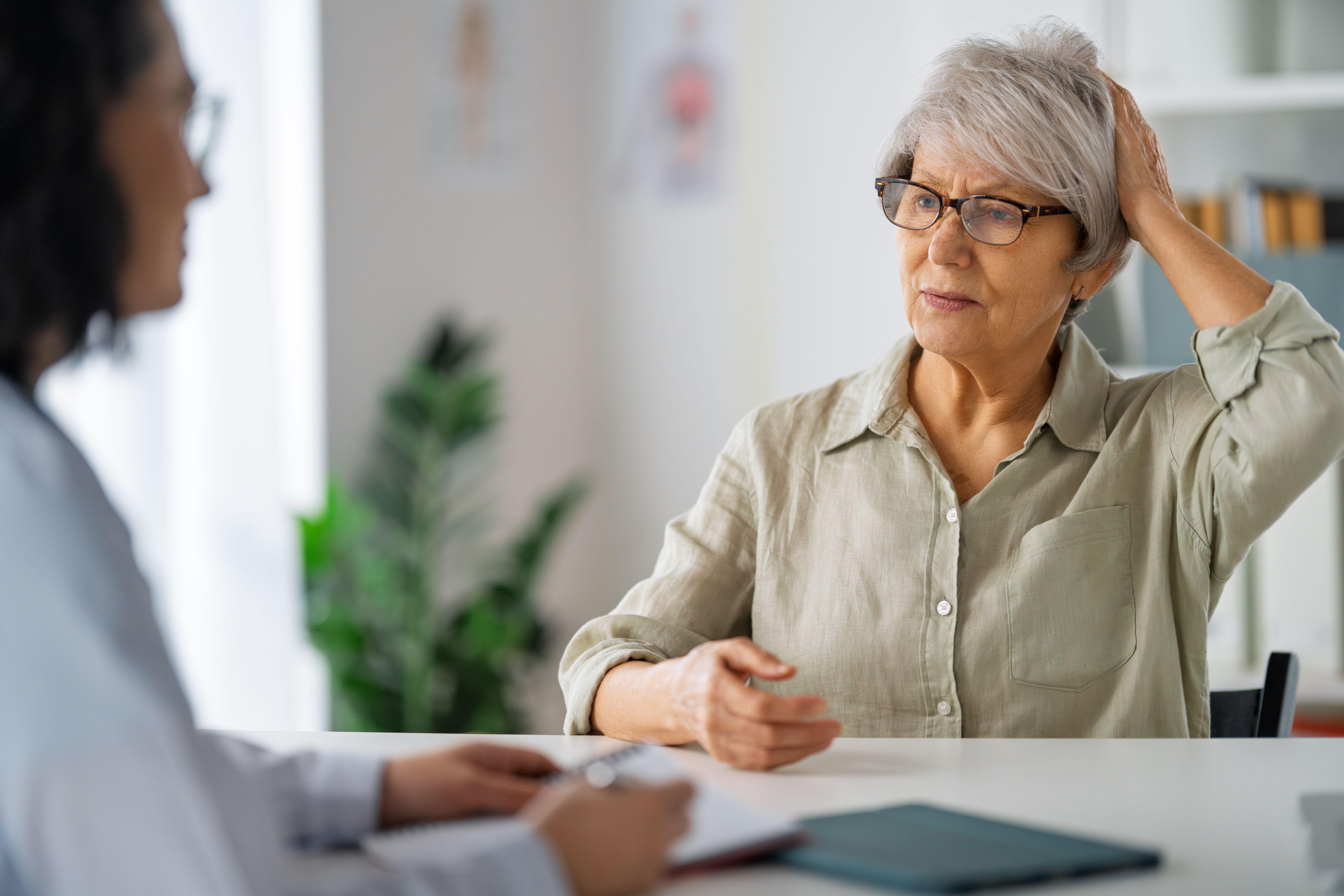 Senior female patient listening to a doctor 