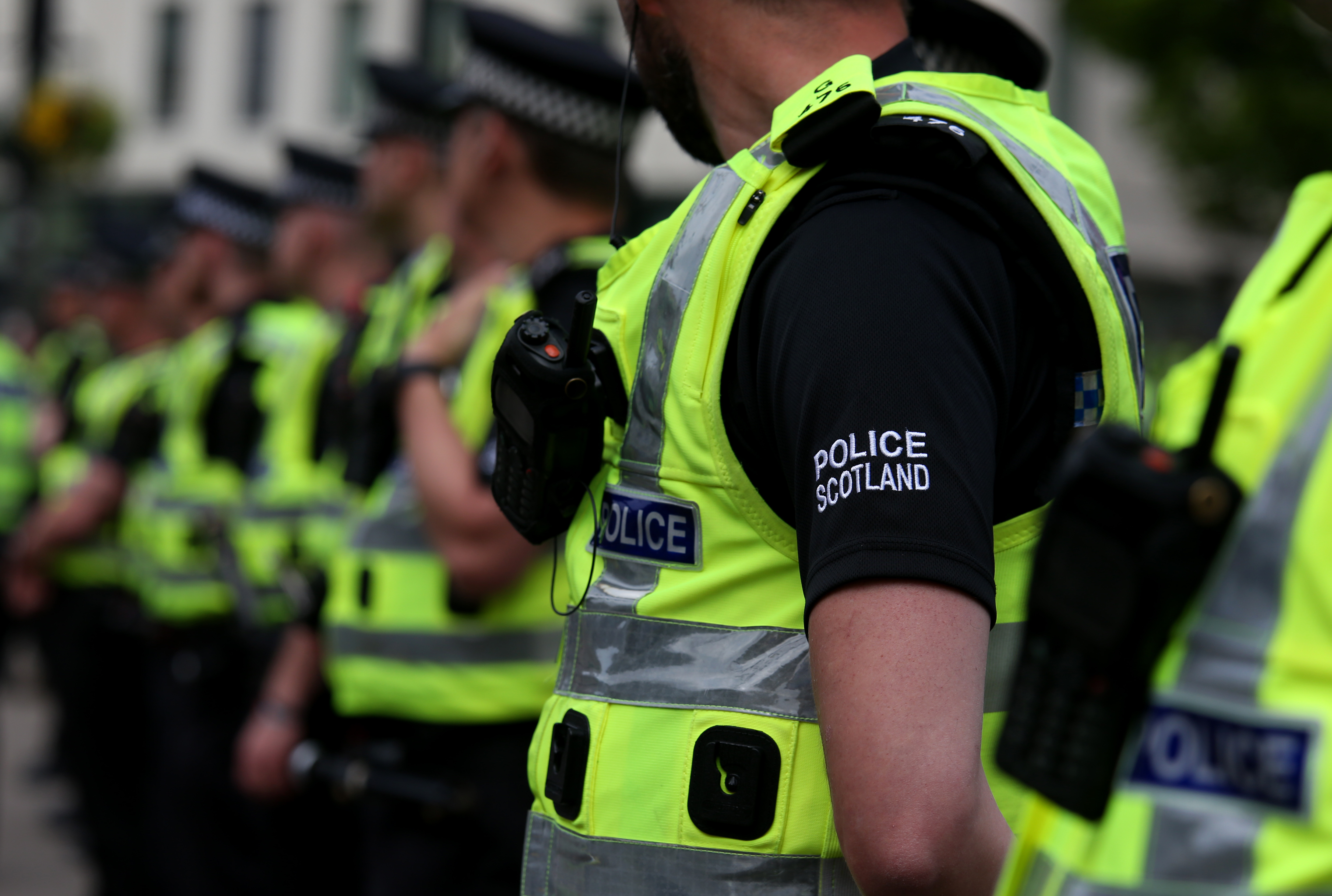Police officers stand in a row