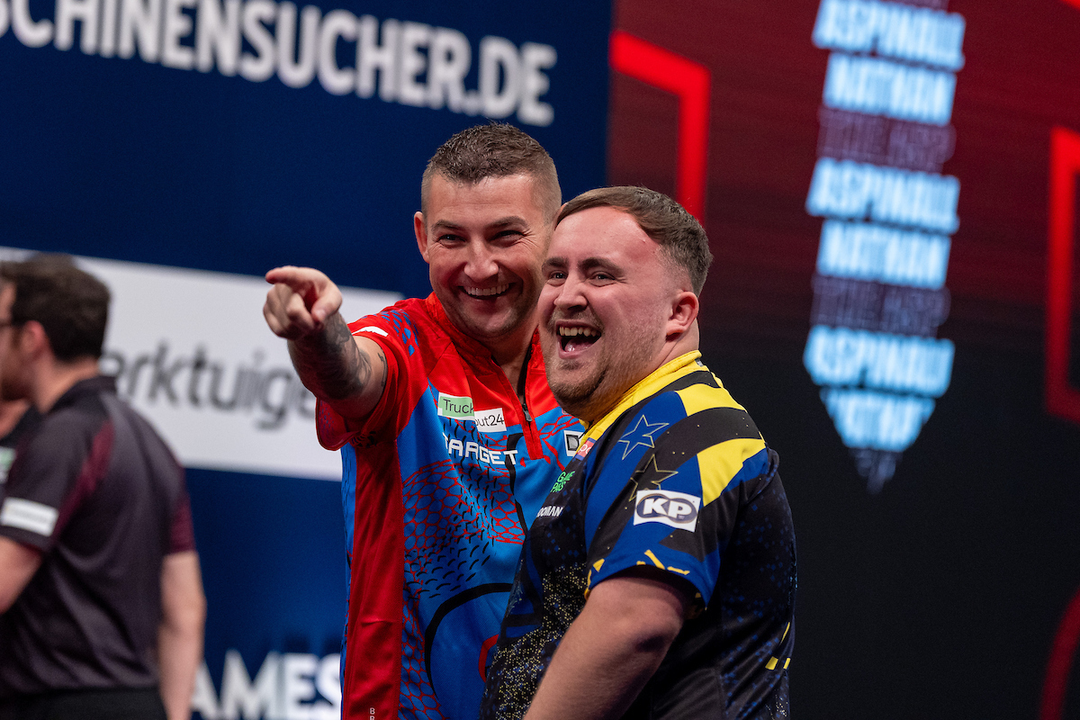 Luke Littler, right, on stage