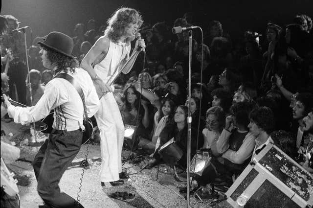 The New York Dolls perform at the Waldorf Halloween Ball at the Waldorf-Astoria Hotel in New York City on October 31 1973