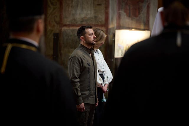 Ukrainian President Volodymyr Zelensky and his wife Olena attend a service in Saint Sophia Cathedral during celebration of the Ukrainian Independence Day in Kyiv 