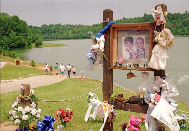 A tribute at the lake where Alex and Michael Smith were drowned in a car in 1994