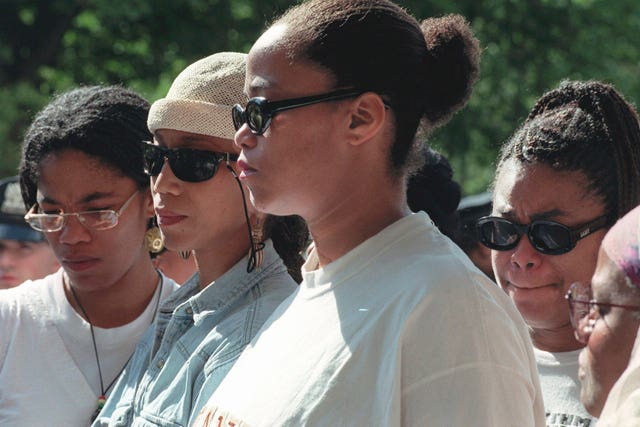 Malcolm X’s daughters Malikah Shabazz, left, Attallah Shabazz, second from left, Malaak Shabazz, third from left, and Gamilah Shabazz, talk to the media outside the Jacobi Medical Centre in the Bronx borough of New York, following the death of their mother, Betty Shabazz on June 23 1997 