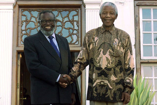 Nelson Mandela shakes hands with Sam Nujoma 