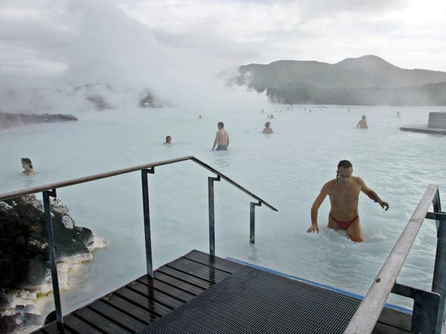 Bathers enjoy the warm water of the Blue Lagoon in Iceland