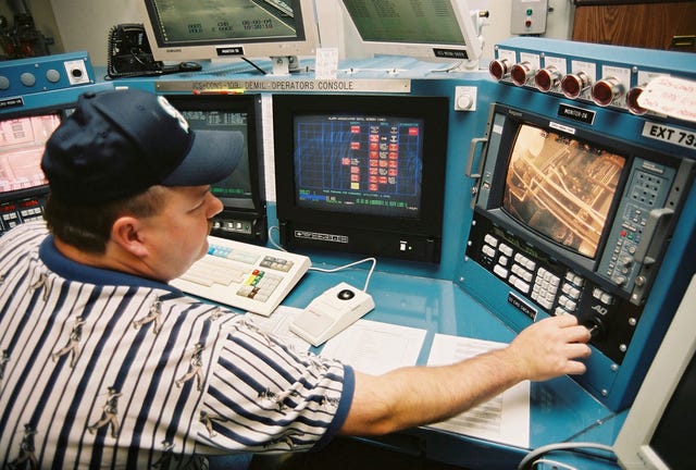 Control room supervisor Lance Pappas consults a video monitor inside the Umatilla Chemical Agent Disposal Facility