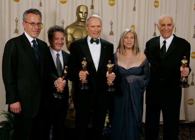 Clint Eastwood, centre, who won two Oscars for Million Dollar Baby, poses with presenters Barbra Stresiand, second from right, and Dustin Hoffman, and producers Albert S Ruddy, right, and Tom Rosenberg at the 77th Academy Awards in Los Angeles