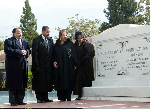 The children of Martin Luther King Jr and Coretta Scott King, from left, Martin Luther King III, Dexter King, Yolanda King and Bernice King stand next to a new crypt dedicated to their parents in Atlanta in 2006