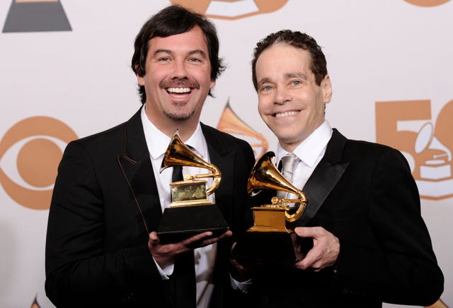 Duncan Sheik, left, and Steven Sater holding a Grammy