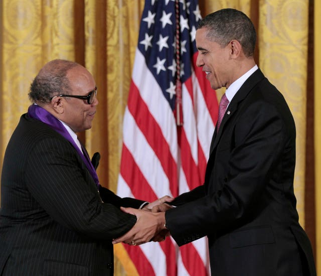 Then-president Barack Obama presents a 2010 National Medal of Arts to musician and record producer Quincy Jones