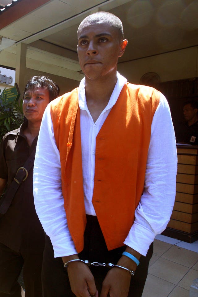 Tommy Schaefer in handcuffs