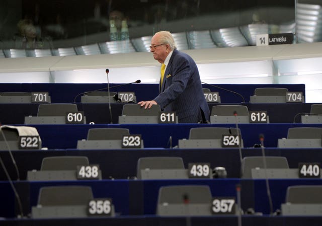 Jean Marie Le Pen looks for his seat at the European Parliament in 2014