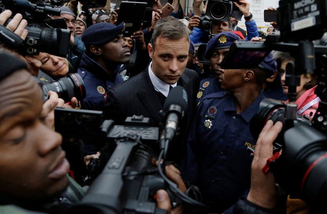 Oscar Pistorius leaves the High Court in Pretoria, South Africa, in 2016 during his trail for the murder of girlfriend Reeva Steenkamp