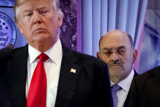 Allen Weisselberg, right, stands behind then president-elect Donald Trump during a news conference in the lobby of Trump Tower in New York on January 11 2017