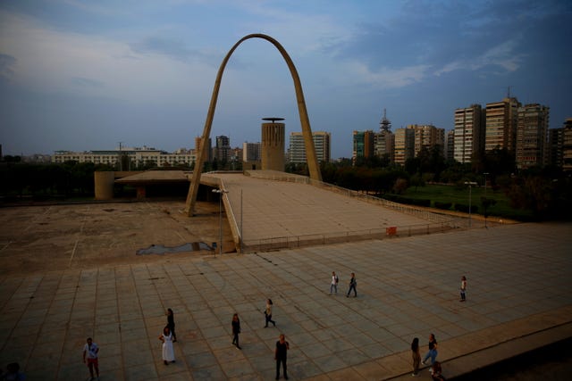 Visitors tour The Open Air Theatre, designed in the early 1960s by the late Brazilian architect Oscar Niemeyer, at the Rashid Karami International Fair in the northern city of Tripoli, Lebanon