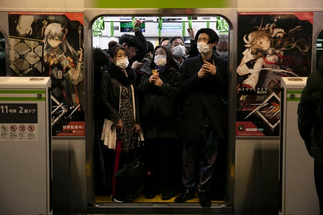 Commuters in masks