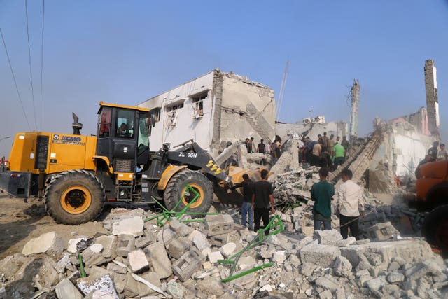 Rescue workers and residents search through the rubble in the aftermath of what Iranian officials said was an Israeli-U.S. strike on a girls’ elementary school in Minab, Iran (Abbas Zakeri/Mehr News Agency via AP)