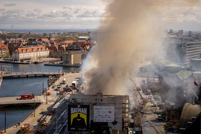 Smoke rises from the Stock Exchange in Copenhagen, Denmark 