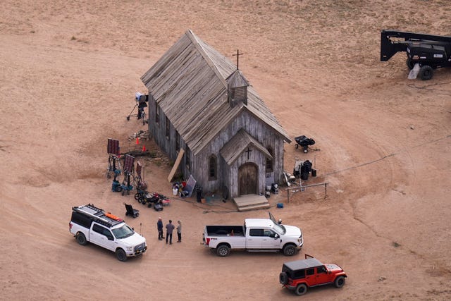 An aerial view of the a wooden church on the set of Rust