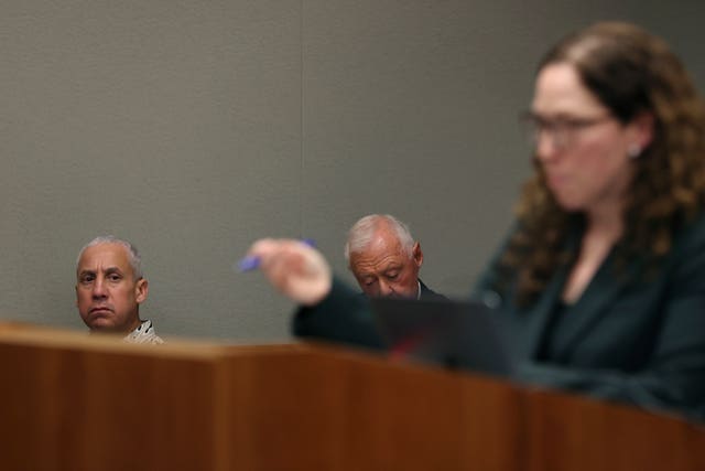 Albert 'Ian' Schweitzer, left, looks on as Innocence Project lawyer Susan Freidman speaks