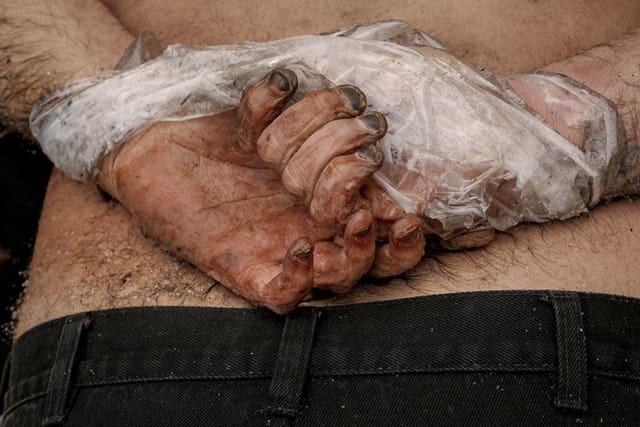The body of a man who was killed with his hands tied behind his back lies on the ground in Bucha, Ukraine, in April 2022