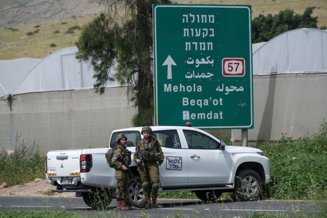 Israeli soldiers set up a roadblock following a shooting attack near the Israeli settlement of Hamra in West Bank at the Jordan Valley, Friday, April 7, 2023
