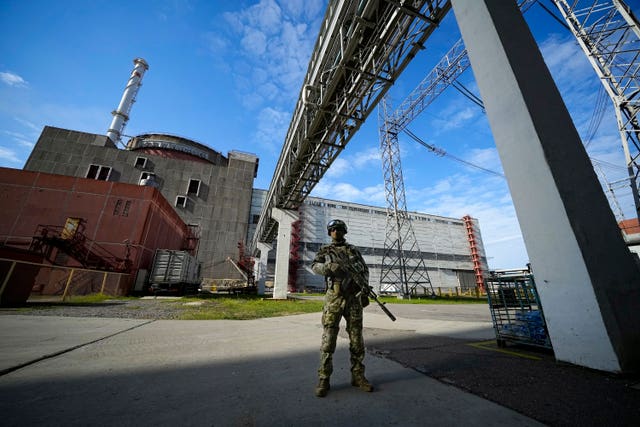 A Russian serviceman guards in an area of the Zaporizhzhia Nuclear Power Station in territory under Russian military control, south-eastern Ukraine