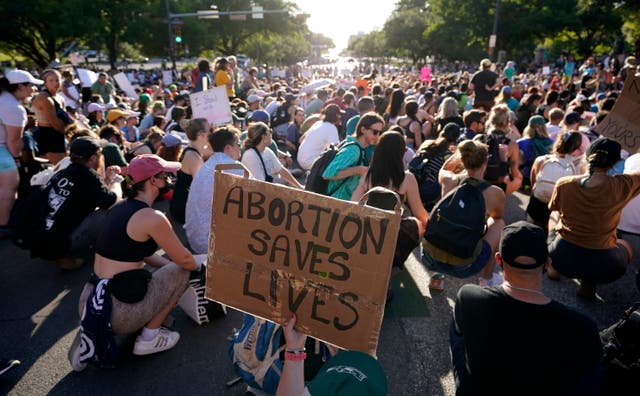 Demonstrators march and gather near the Texas Capitol following the U.S. Supreme Court’s decision to overturn Roe v. Wade, June 24, 2022, in Austin, Texas.