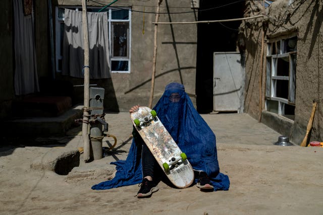 Afghan girl with skateboard