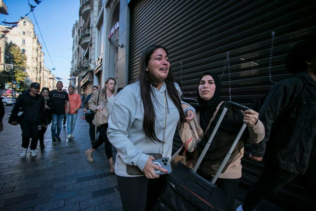 People leave the area after an explosion on Istanbul’s popular pedestrian Istiklal Avenue in 2022