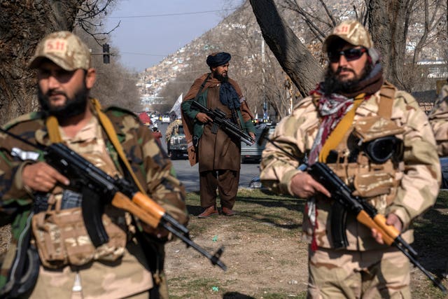 Taliban fighters stand guard in Kabul, Afghanistan