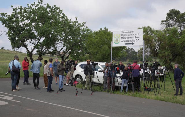 TV crews, photographers and reporters gather outside the gates of the Atteridgeville correctional centre