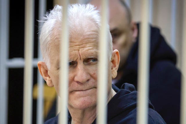 Ales Bialiatski in a defendants’ cage in court