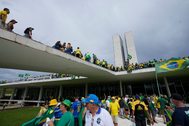 Supporters of Brazil’s former president Jair Bolsonaro storm the National Congress building in Brasilia, Brazil, on Sunday January 8 2023