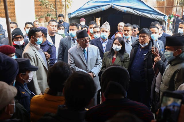 Prime Minister Pushpa Kamal Dahal Prachanda, centre, speaks to officials during his visit to Teaching Hospital in Kathmandu