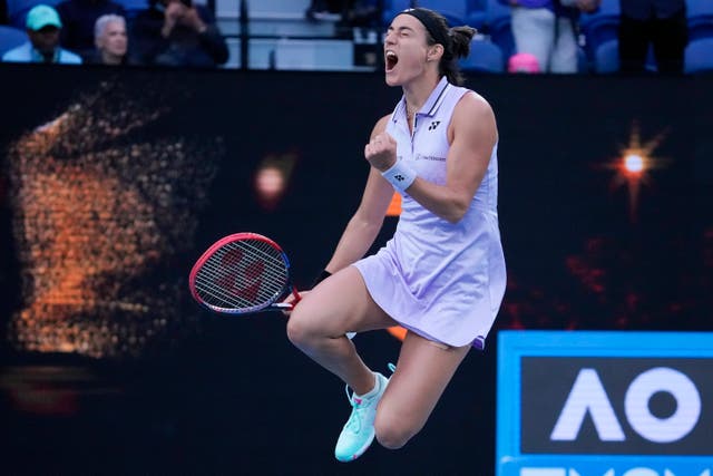 Caroline Garcia leaps in celebration after beating Leylah Fernandez