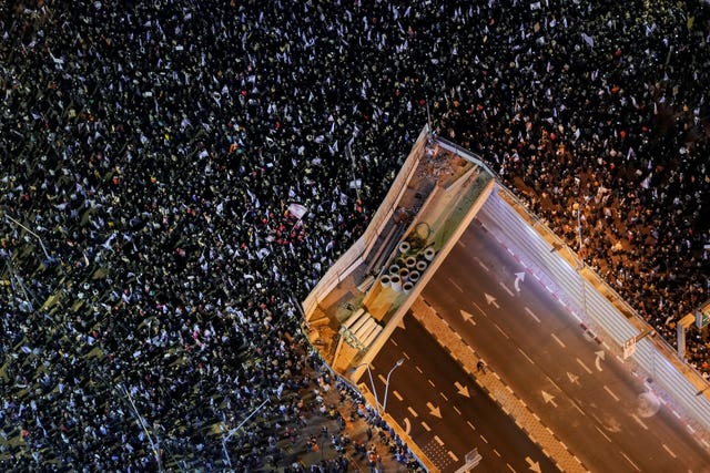 Tens of thousands of Israelis protest against the plans by Prime Minister Benjamin Netanyahu’s new government to overhaul the judicial system, in Tel Aviv 