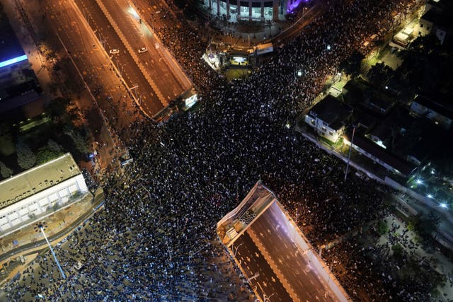 Israelis protest against Prime Minister Benjamin Netanyahu and his far-right government in Tel Aviv