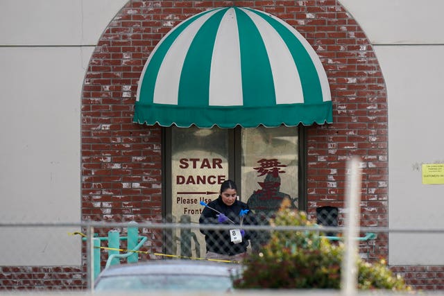 An investigator outside Star Dance Studio in Monterey Park 