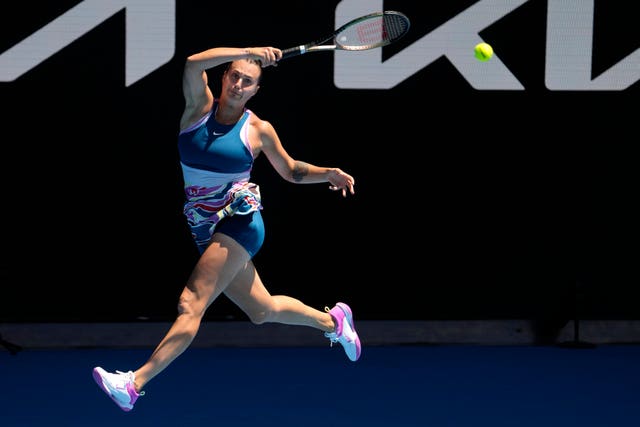 Aryna Sabalenka leaps into a forehand