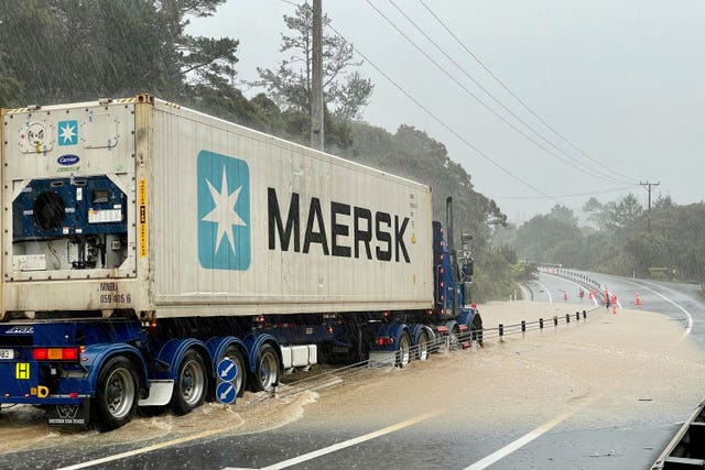 A lorry is stopped by floodwater near Auckland