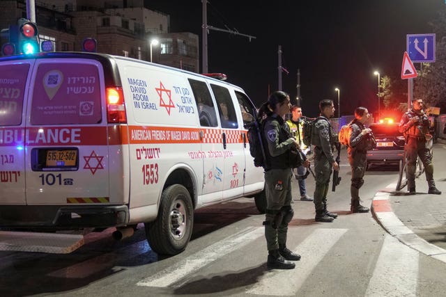 Israeli border police force secure the site of a shooting attack near a synagogue in Jerusalem 