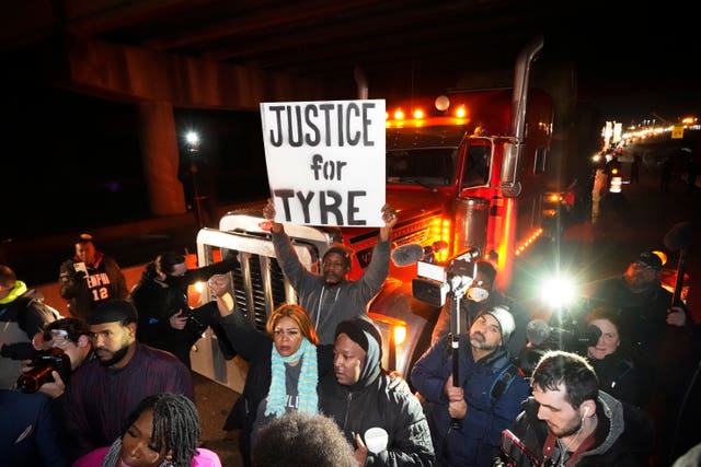 Protesters march down the street on Friday in Memphis as authorities release police video depicting five Memphis officers beating Tyre Nichols, whose death resulted in murder charges and provoked outrage at the country’s latest instance of police brutality 