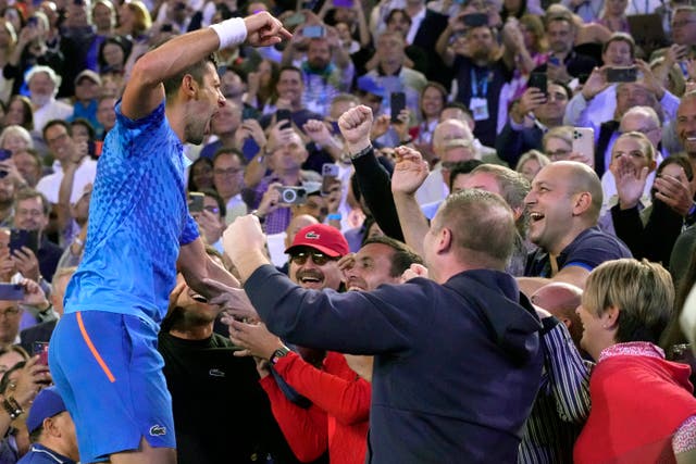 Novak Djokovic celebrates with his team and family