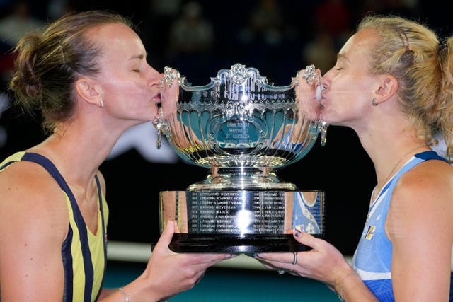 Barbora Krejcikova, left, and Katerina Siniakova kiss the trophy