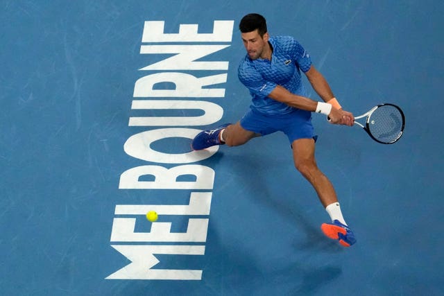 Novak Djokovic stretches for a backhand