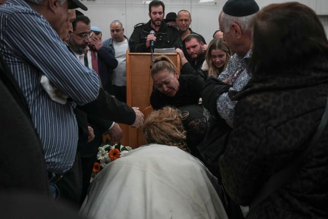 Mourners attend the funeral of Rafael Ben Eliyahu, a victim of Friday's attack in east Jerusalem